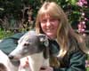 Janice Cooper at home with her greyhound blue